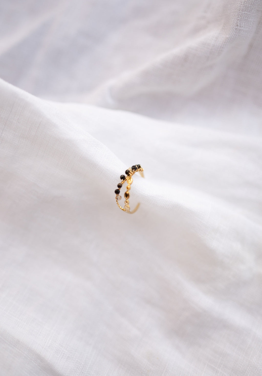 Bague Tily noire et dorée